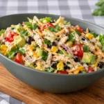 Bowl of southwest chicken salad with chicken, corn, black beans, tomatoes and avocado tossed in creamy dressing